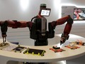 Robot Baxter của công ty Rethink Robotics đang biểu diễn khả năng của nó tại Diễn đàn Kinh tế Thế giới ở tỉnh Liêu Ninh, Trung Quốc - Ảnh: REUTERS