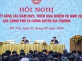 Các đồng chí lãnh đạo chủ trì Hội nghị tổng kết công tác năm 2023, triển khai nhiệm vụ năm 2024 của Chính phủ và chính quyền địa phương. Ảnh VGP/Nhật Bắc