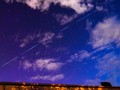Các vệ tinh Starlink của SpaceX có thể được quan sát bằng mắt thường trên bầu trời đêm. Ảnh: The Guardian