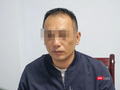 Đối tượng Zhangmao tại cơ quan công an. Ảnh: Công an cung cấp.