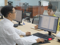 Cán bộ công chức phường Thanh Khê (Đà Nẵng) phục vụ người dân trong ngày đầu thí điểm.
