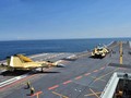 Trung Quốc đang nuôi mộng xây dựng 4-5 cụm tác chiến tàu sân bay trong tương lai. Ảnh: Máy bay J-15 tập cất hạ cánh trên tàu Liêu Ninh