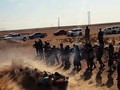 Ảnh chụp từ video clip cho thấy IS đang hành quyết những người chống đối ở Iraq- Ảnh: sheikyermami.com