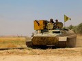 Các chiến binh người Kurd trên xe thiết giáp ở Afrin. Ảnh minh họa Masdar News