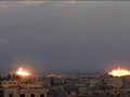 Pháo binh quân đội Syria bắn phá chiến tuyến phiến quân ở Đông Ghouta - ảnh minh họa Masdar News