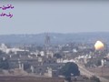 Pháo binh - tên lửa quân đội Syria bắn phá dữ dội thị trấn Al-Lataminah. Ảnh minh họa video Masdar News