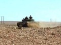 Xe tăng quân đội Syria tiến công trên chiến trường Al-Safa. Ảnh minh họa Masdar BNews