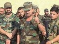 Thiếu tướng Suheil Al-Hassan, tư lệnh trưởng lực lượng Tiger cùng binh sĩ dưới quyền. Ảnh Masdar News