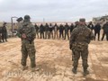 Lính đánh thuê Nga huấn luyện các chiến binh Syria trong khu vực gần chiến trường.