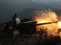 Pháo binh quân đội Syria đánh phá ác liệt chiến tuyến của thánh chiến ở khu phi quân sự. Ảnh minh họa Masdar News