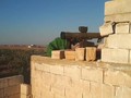 Một tay súng săn tăng của lực lượng NLF tấn công xe tăng quân đội Syria ở Hama.
