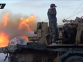Pháo binh quân đội Syria bắn phá chiến tuyến lực lượng Hồi giáo cực đoan ở Hama. Ảnh Masdar News