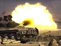 Xe tăng quân đội Syria pháo kích. Ảnh Al-Masdar News