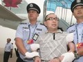 Một quan chức bị truy nã vì buôn lậu, hối lộ quan chức tham nhũng, bị dẫn độ về Bắc Kinh.