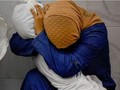 Bức ảnh người cô ôm thi thể cháu gái ở Gaza gây xúc động mạnh (Ảnh: Reuters)