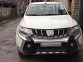 Sau nhiều tháng đấu tranh, khách hàng đã được đổi chiếc xe Mitsubishi Triton mới (Ảnh: NVCC)
