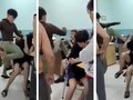 Hai thiếu niên 14 tuổi bị đấm đá dã man tại phòng giám thị Trường THCS Nguyễn Văn Tố, quận 10 (Ảnh cắt từ clip)