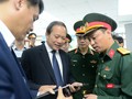 Ảnh minh họa: Bộ trưởng Trương Minh Tuấn khảo sát hoạt động nghiên cứu, sản xuất thiết bị viễn thông của Viettel.