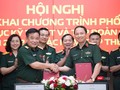 Thiếu tướng Đoàn Minh Định, Phó chủ nhiệm Tổng cục Kỹ thuật và Thiếu tướng Nguyễn Đình Chiến, Phó Tổng giám đốc Viettel ký bản hợp tác chuyển đổi số.