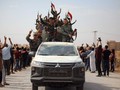 Binh sĩ chính phủ Syria được triển khai tới khắp các thị trấn, làng mạc dọc biên giới với Thổ Nhĩ Kỳ (Ảnh: BBC)