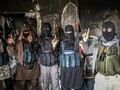 Các tay súng bịt mặt mang nhiều quốc tịch khác nhau của al-Qaeda (Ảnh: Sputnik)