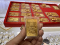 Vàng miếng SJC đồng loạt tăng mức niêm yết 500.000 đồng/lượng trong phiên sáng thứ ba. Ảnh minh hoạ.