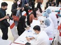 Các tình nguyện viên đăng ký thử nghiệm vaccine phòng COVID-19 ở Học viện Quân Y (Ảnh: Minh Thuý)