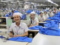 Công nhân lao động kỹ thuật của ngành dệt may Việt Nam (ảnh minh họa VietQ)