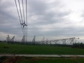 Một cột điện cao thế đổ sập xuống cánh đồng - Ảnh: Facebook