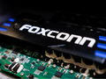 Hệ thống truyền động xe điện hai bánh của Foxconn được trưng bày tại ngày hội công nghệ thường niên của Foxconn ở Đài Bắc, Đài Loan. Ảnh: Reuters.