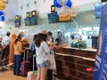 Những hành khách đầu tiên check-in trên chuyến bay quốc tế Đà Nẵng đi Singapore trong sáng ngày 27/3