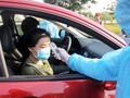 Kiểm tra thân nhiệt người vào TP.HCM tại 1/62 chốt chặn các cửa ngõ thành phố khi thực hiện "cách ly xã hội". Ảnh: GVT.