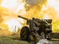 Pháo binh quân đội Syria khai hỏa. Ảnh minh họa Masdar News