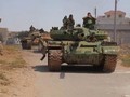 Xe tăng quân đội Syria trên chiến trường Daraa. Ảnh minh họa Masdar News