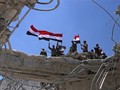 Quân đội Syria thượng cờ trên thủ phủ tỉnh Quneitra. Anh minh họa Masdar News