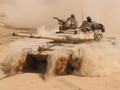 Xe tăng quân đội Syria trên chiến trường sa mạc. Ảnh minh họa Masdar News