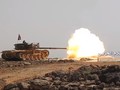 Xe tăng quân đội Syria bắn phá trên chiến trường Al-Safa. Ảnh minh họa Al-Masdar News