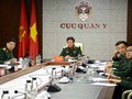 Thiếu tướng, PGS.TS Nguyễn Xuân Kiên cùng các thành viên Đoàn Việt Nam tại điểm cầu Hà Nội. Ảnh: Báo QĐND