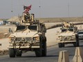 Đoàn xe quân sự Mỹ di chuyển sang Iraq sau khi rút khỏi Đông Bắc Syria (Nguồn: Reuters)