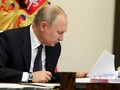 Tổng thống Putin đã ký thông qua luật gia hạn New START với Mỹ (Ảnh: Moscow Times)