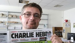Tổng biên tập  tờ Charlie Hebdo, ông Stephane Charbonnier - Ảnh: AP