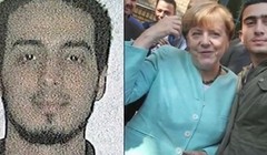 Bà Merkel chụp với người được cho là chiến binh đánh bom tự sát  