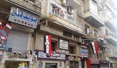 Nhà nhà ở Aleppo treo cờ Syria mừng chiến thắng