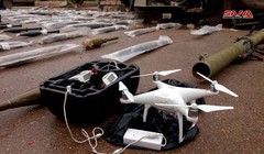 Vũ khí và máy bay trinh sát không người lái UAV, được thu giữ tại Daraa. Ảnh: SANA.