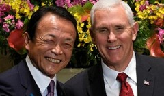 Phó Thủ tướng kiêm Bộ trưởng Tài chính Nhật Bản Taro Aso và Phó Tổng thống Mỹ Mike Pence tiến hánh bắt tay trước cuộc hội đàm ở Tokyo ngày 18/4/2017. Ảnh: Reuters/zaobao