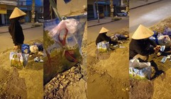 Người phụ nữ ngồi cắt khẩu trang đã sử dụng trong các đống rác