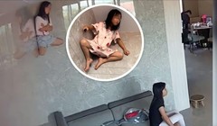 Cô bé dính người trên tường trong khi người nhà bình thản xem tivi bên dưới