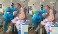 Những hình ảnh  mới nhất cho thấy bệnh nhân 91 đã có thể ngồi dậy, đung đưa chân, bắt đầu tập ăn qua đường tiêu hóa (Ảnh cắt từ clip) 