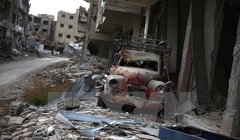 Cảnh đổ nát sau các cuộc giao tranh giữa quân đội chính phủ Syria và phiến quân tại Jobar, ngoại ô thủ đô Damascus ngày 23/1. (Nguồn: AFP/TTXVN)