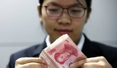 Giới đầu tư và phân tích dự báo đồng NDT sẽ tiếp tục giảm giá trị Ảnh: Zuma Press